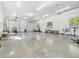 Garage with multiple garage doors, golf cart, and ample space for storage or activities at 920 E Lake Dr, Tarpon Springs, FL 34688