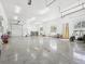 Large garage featuring multiple doors, ample space, and windows at 920 E Lake Dr, Tarpon Springs, FL 34688