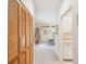 Hallway with a closet and view into the dining room with cabinets at 920 E Lake Dr, Tarpon Springs, FL 34688