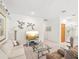 Comfortable living room featuring a glass table, soft lighting, and a relaxing seating area for casual gatherings at 920 E Lake Dr, Tarpon Springs, FL 34688