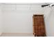 Spacious walk-in closet with carpet and wire shelving providing efficient storage solutions at 920 E Lake Dr, Tarpon Springs, FL 34688