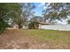 View of the backyard with a white fence enclosing the property at 9287 Horizon Dr, Spring Hill, FL 34608