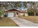 Front exterior view of home featuring a driveway and garage at 9287 Horizon Dr, Spring Hill, FL 34608
