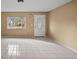 Open living room with natural light and tile flooring at 9287 Horizon Dr, Spring Hill, FL 34608