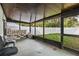 Enclosed patio overlooking the backyard at 9287 Horizon Dr, Spring Hill, FL 34608