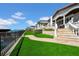 Waterfront property with lush turf, a paved pathway, and access to the dock at 940 Monte Cristo Blvd, Tierra Verde, FL 33715