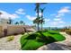 Backyard with an inviting hammock, lush turf, and waterfront views at 940 Monte Cristo Blvd, Tierra Verde, FL 33715