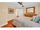 Well-lit bedroom featuring ceiling fan and dresser at 940 Monte Cristo Blvd, Tierra Verde, FL 33715