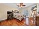 Comfortable bedroom with balcony access and hardwood floors at 940 Monte Cristo Blvd, Tierra Verde, FL 33715
