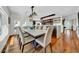 Open-concept dining room featuring hardwood floors and neutral décor at 940 Monte Cristo Blvd, Tierra Verde, FL 33715