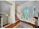 Inviting entryway with decorative glass door and staircase at 940 Monte Cristo Blvd, Tierra Verde, FL 33715