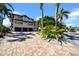 Beautiful two-story home featuring a three-car garage and well-maintained grounds at 940 Monte Cristo Blvd, Tierra Verde, FL 33715