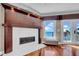 Living area featuring a modern fireplace, ocean views, and access to the balcony at 940 Monte Cristo Blvd, Tierra Verde, FL 33715