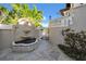 Charming front entrance with beautiful fountain, tropical foliage, and wrought-iron gate at 940 Monte Cristo Blvd, Tierra Verde, FL 33715