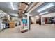 Spacious garage with epoxy floor, custom cabinets, and organized storage for functionality at 940 Monte Cristo Blvd, Tierra Verde, FL 33715
