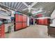 Spacious garage with epoxy floor, custom cabinets, and ample storage for organization at 940 Monte Cristo Blvd, Tierra Verde, FL 33715