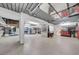 Spacious garage with epoxy floor, custom cabinets, and organized storage for functionality at 940 Monte Cristo Blvd, Tierra Verde, FL 33715