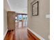 Hallway leading to a large room with floor to ceiling windows and a view of the beach at 940 Monte Cristo Blvd, Tierra Verde, FL 33715