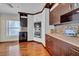 Modern kitchen features custom cabinets, stainless appliances, hardwood floors, and stylish backsplash at 940 Monte Cristo Blvd, Tierra Verde, FL 33715