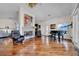 Spacious living room with fireplace, piano, hardwood floors, and ample natural light at 940 Monte Cristo Blvd, Tierra Verde, FL 33715