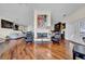 Open-concept living room with hardwood floors, fireplace, comfortable seating, and stylish decor at 940 Monte Cristo Blvd, Tierra Verde, FL 33715