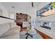 Bright living room with fireplace, hardwood floors, stylish decor, and comfortable seating area at 940 Monte Cristo Blvd, Tierra Verde, FL 33715