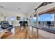 Large living room with piano, telescope, and sliding doors leading to a balcony with water views at 940 Monte Cristo Blvd, Tierra Verde, FL 33715