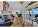 Relaxing living room with a fireplace, piano, and balcony access at 940 Monte Cristo Blvd, Tierra Verde, FL 33715