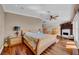 Cozy main bedroom boasts a fireplace, hardwood floors, and ample closet space at 940 Monte Cristo Blvd, Tierra Verde, FL 33715