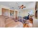 Spacious home office with hardwood floors, custom cabinets, and comfortable seating area at 940 Monte Cristo Blvd, Tierra Verde, FL 33715