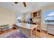 Well-appointed home office with desk, shelves, and ample natural light at 940 Monte Cristo Blvd, Tierra Verde, FL 33715