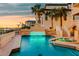 Stunning pool and spa area with beautiful lighting and well-manicured landscaping at 940 Monte Cristo Blvd, Tierra Verde, FL 33715