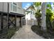 Side yard featuring a generator and tropical plants at 940 Monte Cristo Blvd, Tierra Verde, FL 33715