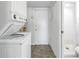 Laundry area with washer, dryer, and door to the shower at 10086 Seminole Blvd, Seminole, FL 33772