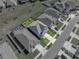 Aerial view of a home showcasing a well-maintained lawn surrounded by a black fence at 11232 Bram Bay Ct, San Antonio, FL 33576
