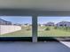 View from patio through the screen of the backyard at 11232 Bram Bay Ct, San Antonio, FL 33576