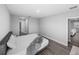 Bedroom featuring wood look floors and entry ways to bathroom and living room at 11232 Bram Bay Ct, San Antonio, FL 33576