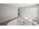 Bedroom showcases carpet flooring, closet, and natural light at 11232 Bram Bay Ct, San Antonio, FL 33576