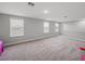 Expansive bonus room featuring neutral carpeting, recessed lighting, and multiple windows at 11232 Bram Bay Ct, San Antonio, FL 33576