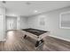 Bright game room with a pool table, light gray walls and attractive wood-look vinyl flooring at 11232 Bram Bay Ct, San Antonio, FL 33576