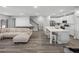 Open-concept kitchen with a large island, modern appliances, and seamless connection to the living space at 11232 Bram Bay Ct, San Antonio, FL 33576