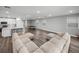 Spacious living room featuring a large sectional sofa and a billiard table for entertaining at 11232 Bram Bay Ct, San Antonio, FL 33576