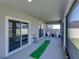 View of the covered patio featuring seating and mini golf at 11232 Bram Bay Ct, San Antonio, FL 33576