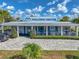 Charming Welcome Center featuring a well-maintained lawn, inviting entrance, and clear signage for easy navigation at 11232 Bram Bay Ct, San Antonio, FL 33576