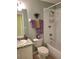 Bathroom featuring a shower-tub combo, decorative towels, and an ample sink and countertop at 1318 Misty Greens Dr, Sun City Center, FL 33573