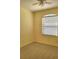 Cozy bedroom featuring neutral carpet, a ceiling fan, and a window offering plenty of natural light at 1318 Misty Greens Dr, Sun City Center, FL 33573