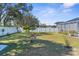 Spacious backyard with mature trees and full vinyl fencing at 13424 Hunters Point St, Spring Hill, FL 34609