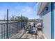 Balcony with seating overlooks backyard, providing an outdoor lounge area at 13424 Hunters Point St, Spring Hill, FL 34609