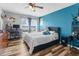 Comfortable bedroom featuring natural light and laminate wood floors at 13424 Hunters Point St, Spring Hill, FL 34609