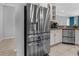 Modern stainless steel refrigerator complementing the updated kitchen at 13424 Hunters Point St, Spring Hill, FL 34609